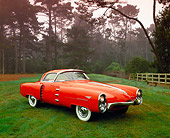 AUT 21 RK1435 07
1955 Boano Indy Lincoln Chasis Orange Prototype 3/4 Front View On Grass By Trees