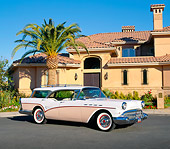 AUT 21 RK1548 01
1957 Buick Century Estate Wagon Pink And White 3/4 Side View By Building And Palm Tree Blue Sky
