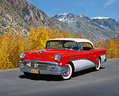 AUT 21 RK1551 04
1956 Buick Century Red And White 3/4 Front View On Pavement By Bushes Blue Sky