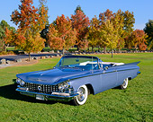 AUT 21 RK1563 04
1959 Buick Le Sabre Convertible Blue 3/4 Front View On Grass By Bushes