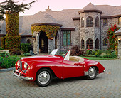 AUT 21 RK1679 02
1951 Jowett Jupiter Roadster Red 3/4 Side View On Driveway By House