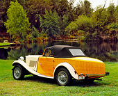 AUT 21 RK1797 04
1952 MG TD Boattail Roadster Ivory 3/4 Rear View On Grass By Water