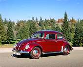 AUT 21 RK1839 01
1956 Volkswagen Oval Bug Red 3/4 Side View On Pavement Trees Background