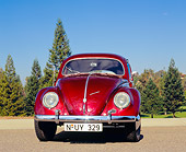 AUT 21 RK1840 01
1956 Volkswagen Oval Beetle Red Low Head On Shot On Pavement Trees Background