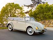 AUT 21 RK2404 01
1958 Volkswagen Beetle Convertible White And Gray 3/4 Front View On Pavement By Stone Wall