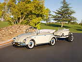 AUT 21 RK2405 01
1958 Volkswagen Beetle Convertible White And Gray 3/4 Front View On Pavement By Stone Wall Towing Scale Model