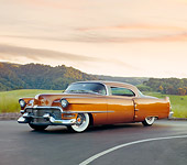 AUT 21 RK2413 01
1954 Cadillac Coupe de Ville Bronze 3/4 Front View On Pavement By Hills