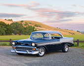 AUT 21 RK2419 01
1956 Chevrolet Bel Air Black And Silver 3/4 Front View On Gravel By Hills