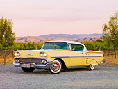 AUT 21 RK2430 01
1958 Chevrolet Impala Yellow 3/4 Front View On Gravel By Vineyard