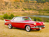 AUT 21 RK2466 01
1958 Packard Red 3/4 Front View On Dry Grass By Lake And Hills