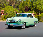 AUT 21 RK2469 01
1953 Plymouth Cranbrook Convertible Light Green 3/4 Front View On Pavement By Trees