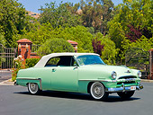 AUT 21 RK2470 01
1953 Plymouth Cranbrook Convertible Light Green 3/4 Front View On Pavement By Trees