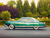 AUT 21 RK2478 01
1954 Kaiser Manhattan Green And Cream Profile View On Pavement By Shrubs And Trees