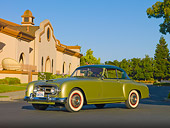 AUT 21 RK2488 01
1954 Nash-Healey LeMans Coupe Green 3/4 Front View On Pavement By Building
