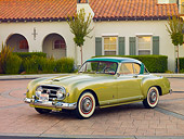 AUT 21 RK2490 01
1954 Nash-Healey LeMans Coupe Green 3/4 Front View On Pavement By Building