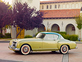 AUT 21 RK2492 01
1954 Nash-Healey LeMans Coupe Green 3/4 Front View On Pavement By Building