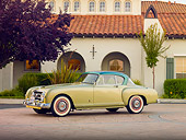 AUT 21 RK2493 01
1954 Nash-Healey LeMans Coupe Green 3/4 Front View On Pavement By Building