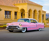AUT 21 RK2546 01
1955 Cadillac Coupe de Ville Pink 3/4 Front View On Pavement By House