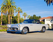 AUT 21 RK2569 01
1955 Ford Thunderbird Convertible Silver 3/4 Front View On Pavement By Palm Trees