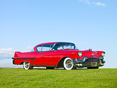 AUT 21 RK2593 01
1957 Cadillac Coupe de Ville Red 3/4 Front View On Grass