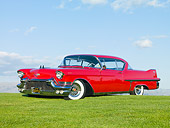 AUT 21 RK2594 01
1957 Cadillac Coupe de Ville Red 3/4 Front View On Grass