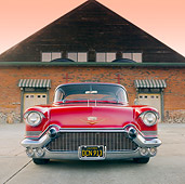AUT 21 RK2598 01
1957 Cadillac Coupe de Ville Red Front View On Pavement By Building