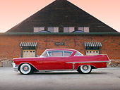 AUT 21 RK2599 01
1957 Cadillac Coupe de Ville Red Profile View On Pavement By Building