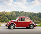AUT 21 RK2628 01
1956 Volkswagen Oval Bug Burgandy Profile View On Pavement By Water