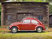 AUT 21 RK2629 01
1956 Volkswagen Oval Bug Burgandy Profile View On Dirt By Old Shop