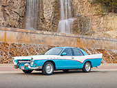 AUT 21 RK2630 01
Mercury Grand Marquis DeSoto Custom Blue And White 3/4 Side View On Pavement By Waterfall