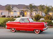 AUT 21 RK2643 01
1955 Nash Metropolitan Convertible Red 3/4 Side View On Pavement By House
