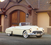 AUT 21 RK2646 01
1950 Oldsmobile 88 Convertible White 3/4 Front View On Gravel By House