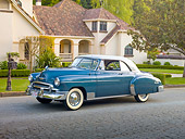 AUT 21 RK2662 01
1950 Chevrolet Bel Air Blue And Gray 3/4 Side View On Pavement By House