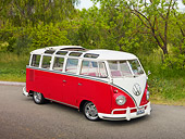 AUT 21 RK2691 01
1959 Volkswagen 23 Window Microbus Raspberry And White 3/4 Front View On Pavement By Trees