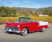 AUT 21 RK2708 01
1955 Chevrolet Bel Air Convertible Red And White 3/4 Front View On Pavement By Grassy Hill