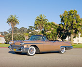 AUT 21 RK2722 01
1958 Cadillac El Dorado Biarritz Bronze 3/4 Front View On Pavement By Trees And Building