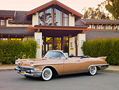 AUT 21 RK2728 01
1958 Cadillac El Dorado Biarritz Bronze 3/4 Front View On Pavement By Building And Hedges