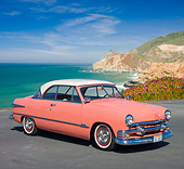 AUT 21 RK2812 01
1951 Ford Victoria Coral And White 3/4 Front View On Pavement By Beach