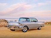AUT 21 RK2829 01
1957 Chevrolet Bel Air Silver 3/4 Front View On Sand By Ocean At Dusk