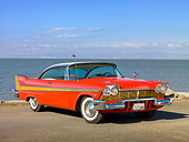 AUT 21 RK2855 01
1957 Plymouth Fury Red And Gold 3/4 Front View On Pavement By Bay