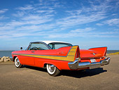 AUT 21 RK2856 01
1957 Plymouth Fury Red And Gold 3/4 Rear View On Pavement By Bay