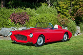 AUT 21 RK2880 01
1958 Moore Roadster Red 3/4 Front View On Grass By Stones And Shrubs