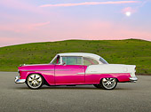 AUT 21 RK2913 01
1955 Chevrolet Bel Air Pink And White Profile View On Gravel By Grassy Hills At Dusk