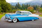 AUT 21 RK2929 01
1956 Chevrolet Bel Air Blue And White 3/4 Side View On Pavement In Forest