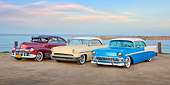 AUT 21 RK2938 01
1948 Chevrolet Fleetline Aerosedan Burgundy, 1953 Mercury Monterey Yellow And White And 1956 Chevrolet Bel Air Blue And White On Dirt Road By Water