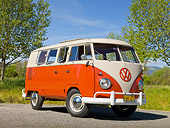 AUT 21 RK3036 01
1959 VW SO23 Westfalia Camper Red And Beige Gray 3/4 Front View On Gravel By Grass And Trees