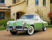 AUT 21 RK3047 01
1952 Studebaker Commander Coupe Green 3/4 Front View On Brick By Stone House