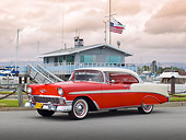 AUT 21 RK3063 01
1956 Chevrolet Bel Air Matador Red And Dune Beige 3/4 Side View On Pavement By Harbor