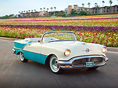 AUT 21 RK3094 01
1956 Oldsmobile Super 88 Teal And White 3/4 Front View On Pavement By Flowers