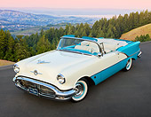 AUT 21 RK3095 01
1956 Oldsmobile Super 88 Teal And White 3/4 Front View On Pavement By Hills